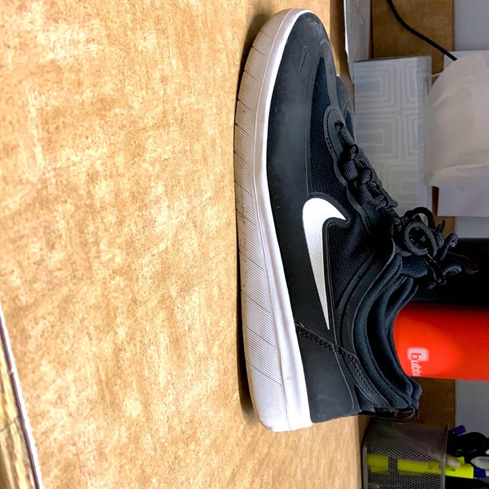 Mens size 7.5 (womens 9) black and white Nyjah Huston Nikes.